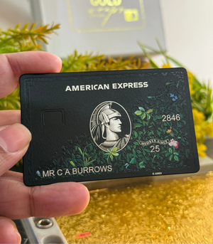 Premium black AMX metal card featuring sophisticated floral patterns for high-end professionals