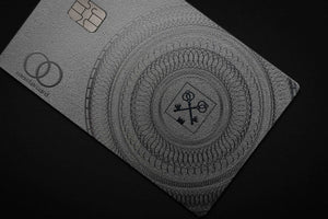 Elite Goldman Lampe silver metal card with intricate engraved silver detailing for luxury branding