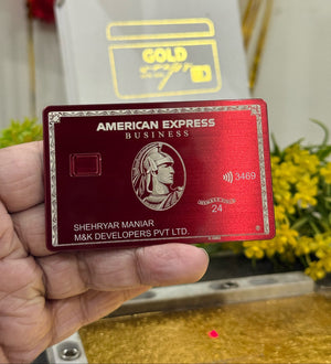 Red Plum American Express Business card held by a hand with a blurred background