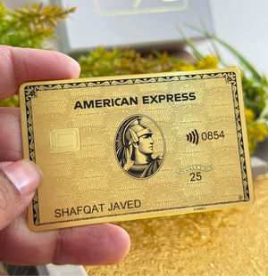 Angled view of Gold Amex metal card by Gold Wraps, showcasing premium custom metal card design