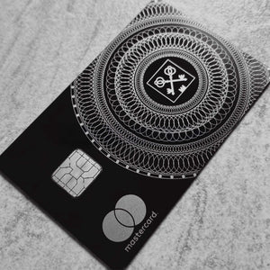 Elite Goldman Lampe black metal card with intricate engraved detailing for luxury branding